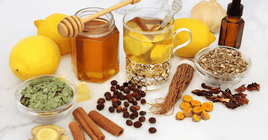 Assortment of natural remedies including lemon, honey, herbal tea, and essential oils, arrayed to promote holistic health and aid in the natural treatment of conditions like sciatica.